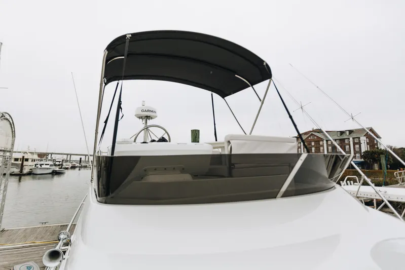  Yacht Photos Pics 2026 Beneteau Antares 11 Fly yacht with flybridge, docked at marina.