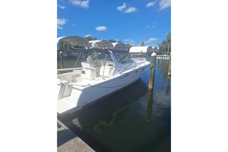  Yacht Photos Pics 2002 Tiara 3500 Open yacht docked in a sunny marina, clear blue sky.