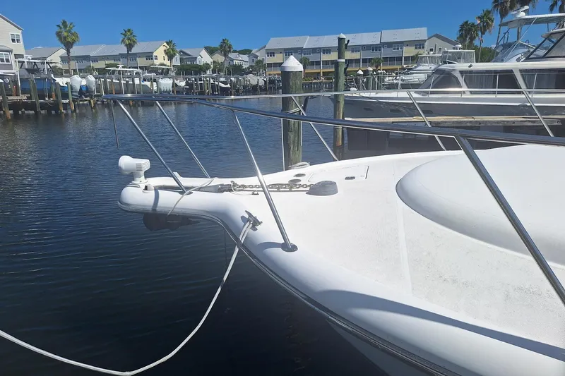  Yacht Photos Pics Bow of a 2002 Tiara 3500 Open yacht docked in a marina.