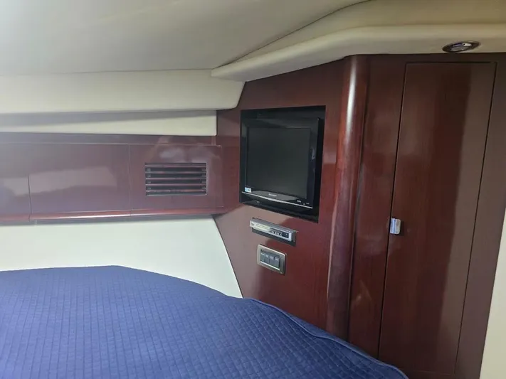  Yacht Photos Pics Interior of 2008 Sea Ray 40 Sundancer with TV and wood paneling.