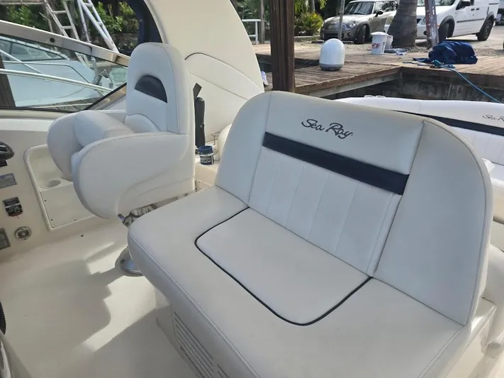  Yacht Photos Pics 2008 Sea Ray 40 Sundancer interior with white seating and helm, dockside view.
