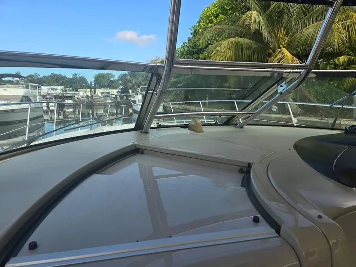  Yacht Photos Pics 2008 Sea Ray 40 Sundancer yacht interior with marina and palm trees in background.