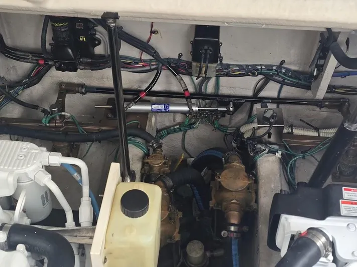  Yacht Photos Pics Engine compartment of a 2008 Sea Ray 40 Sundancer, showcasing mechanical components and wiring.