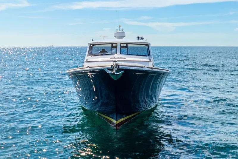 Volatility Yacht Photos Pics Front view of a 2003 San Juan SJ 38 boat on open water.