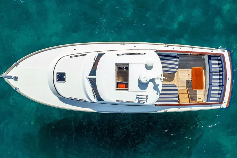 Volatility Yacht Photos Pics Aerial view of 2003 San Juan SJ 38 yacht on clear blue water.