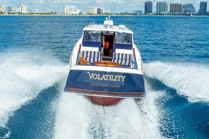 Volatility Yacht Photos Pics San Juan SJ 38 boat named "Volatility" cruising near Florida skyline, 2003 model.