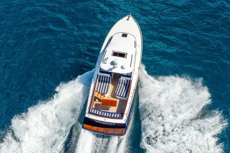 Volatility Yacht Photos Pics San Juan SJ 38 yacht cruising on blue ocean waters, aerial view, 2003 model.