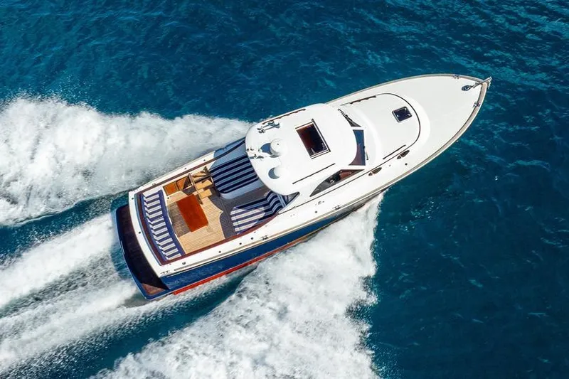 Volatility Yacht Photos Pics Aerial view of 2003 San Juan SJ 38 yacht cruising on blue ocean waters.