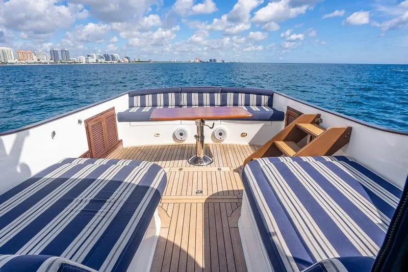 Volatility Yacht Photos Pics Luxury San Juan SJ 38 yacht deck with striped seating, ocean view, 2003 model.