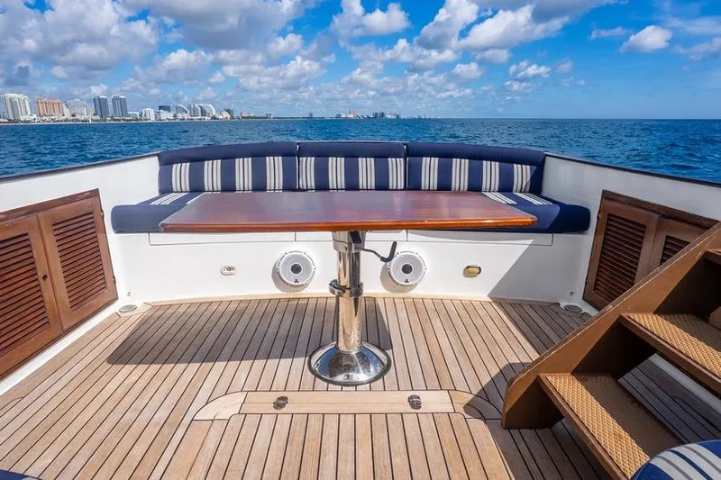 Volatility Yacht Photos Pics Luxurious San Juan SJ 38 yacht deck with seating, table, and ocean view, 2003 model.