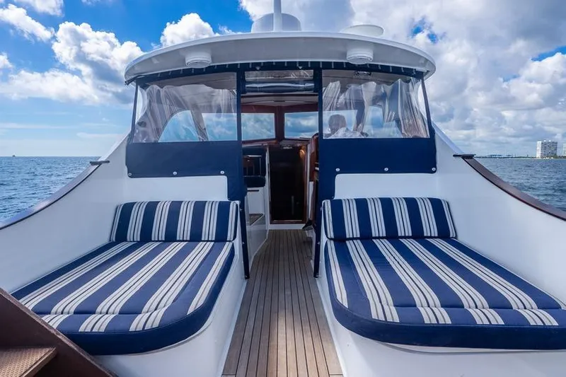 Volatility Yacht Photos Pics Luxury San Juan SJ 38 yacht interior with striped seating, 2003 model, ocean view.