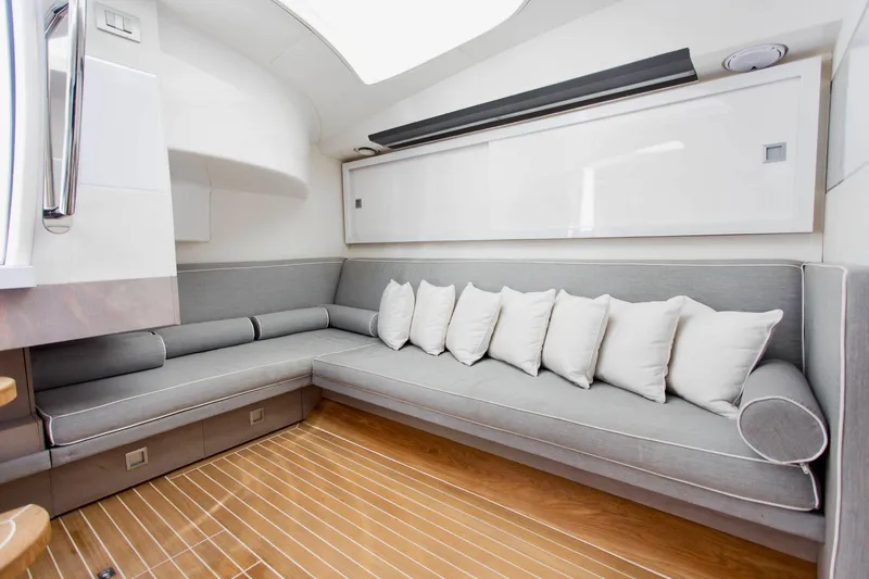  Yacht Photos Pics Luxurious interior of 2007 Baia BAIA ONE 43 yacht with gray seating and white pillows.