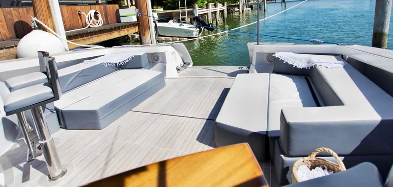  Yacht Photos Pics Luxurious 2007 Baia BAIA ONE 43 yacht deck with elegant seating and waterfront view.