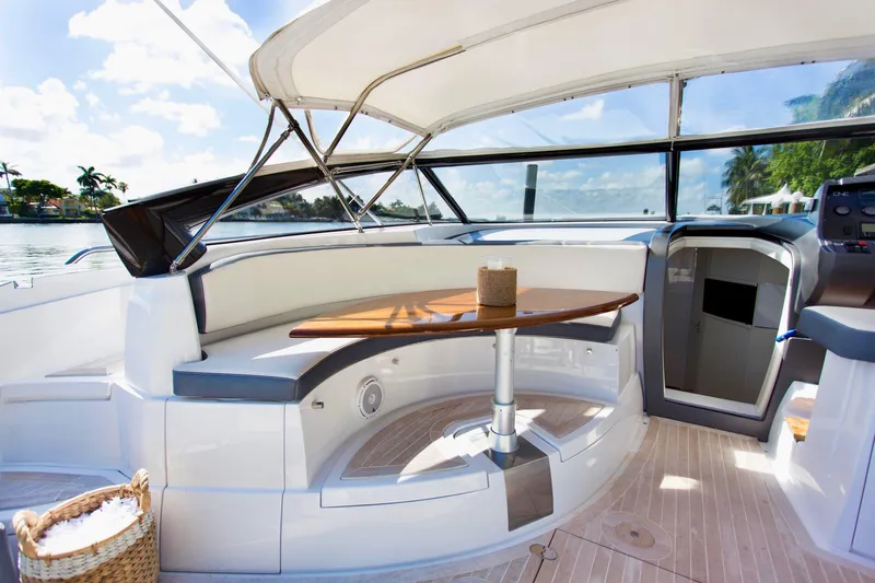  Yacht Photos Pics Luxurious 2007 Baia BAIA ONE 43 yacht interior with elegant seating and wooden table.