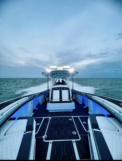  Yacht Photos Pics 2016 Yellowfin 39 boat cruising on open water at sunset.