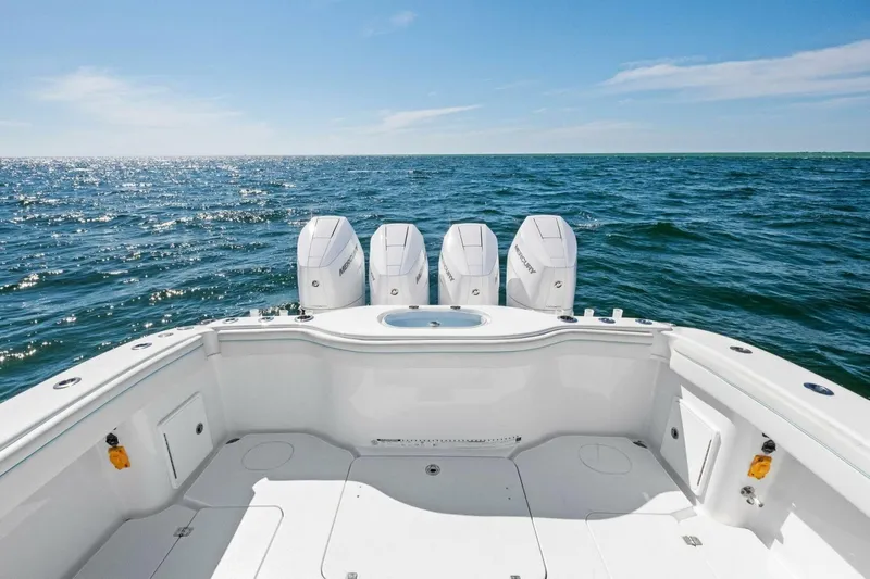 Midnight Rider Yacht Photos Pics 2017 Yellowfin 42 Offshore boat with triple outboard motors on open sea.