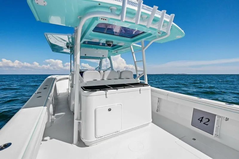 Midnight Rider Yacht Photos Pics 2017 Yellowfin 42 Offshore boat on open sea under clear blue sky.