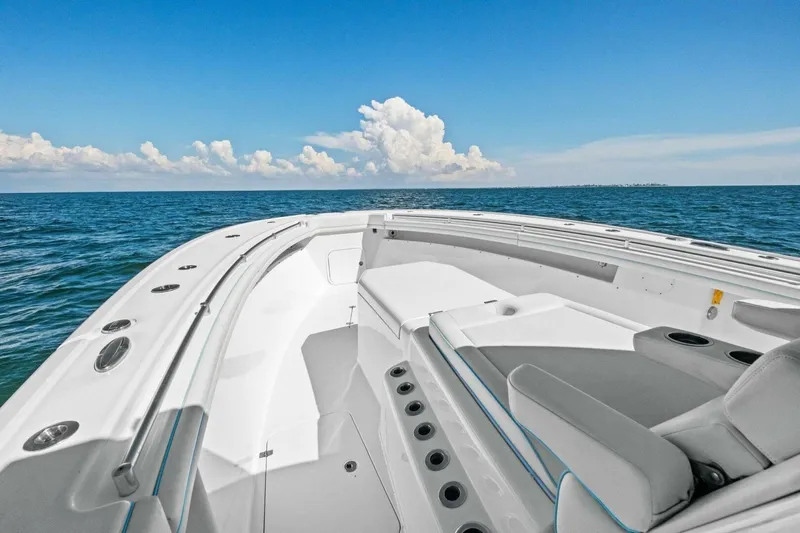 Midnight Rider Yacht Photos Pics 2017 Yellowfin 42 Offshore boat on open sea under clear blue sky.