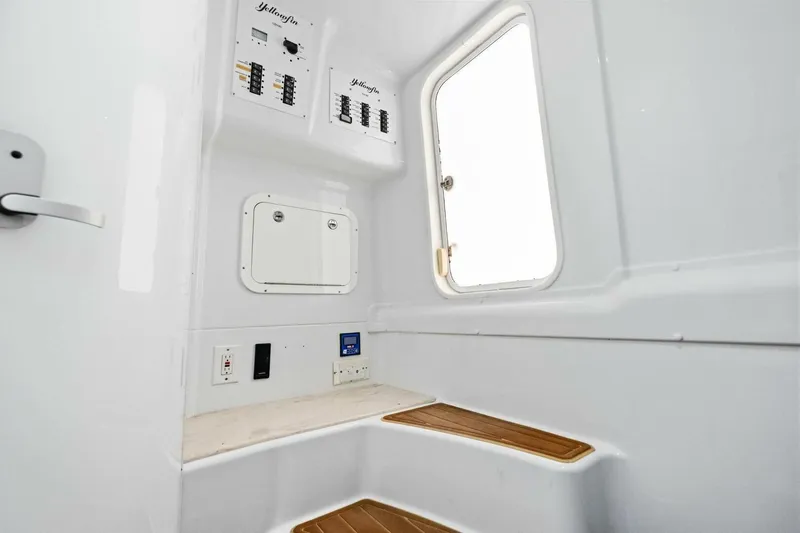 Midnight Rider Yacht Photos Pics Interior of 2017 Yellowfin 42 Offshore boat, featuring control panels and a window.