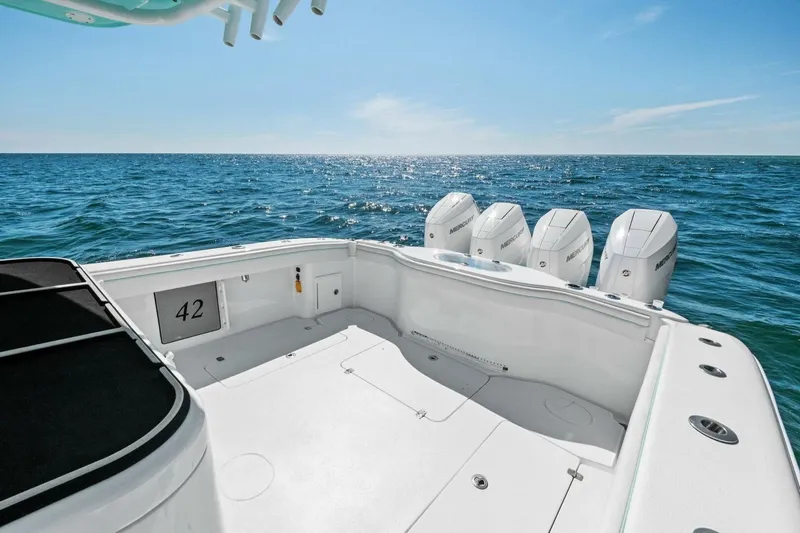 Midnight Rider Yacht Photos Pics 2017 Yellowfin 42 Offshore boat with four outboard engines on open sea.