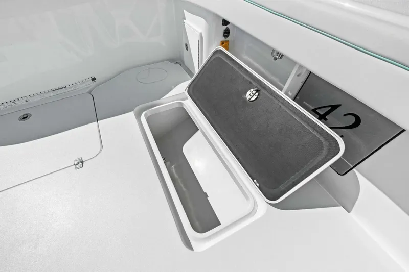 Midnight Rider Yacht Photos Pics 2017 Yellowfin 42 Offshore boat storage compartment with open lid.