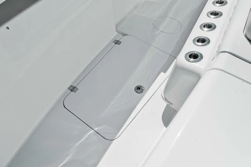 Midnight Rider Yacht Photos Pics 2017 Yellowfin 42 Offshore boat deck with rod holders and storage hatch.