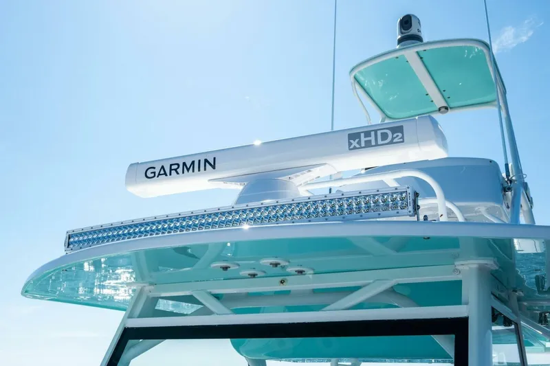 Midnight Rider Yacht Photos Pics 2017 Yellowfin 42 Offshore boat with Garmin xHD2 radar against clear blue sky.