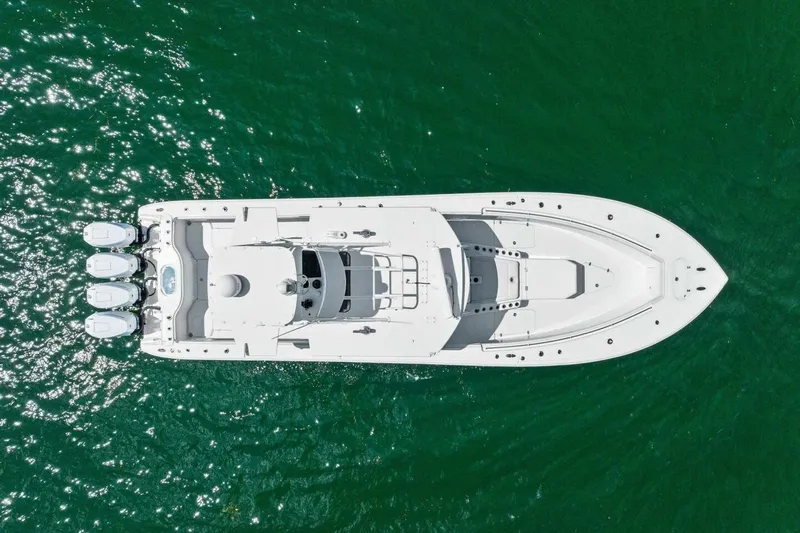 Midnight Rider Yacht Photos Pics Aerial view of 2017 Yellowfin 42 Offshore boat on green water.