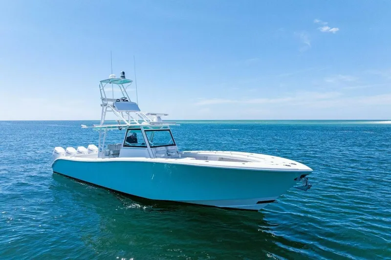 Midnight Rider Yacht Photos Pics 2017 Yellowfin 42 Offshore boat on clear blue ocean waters.