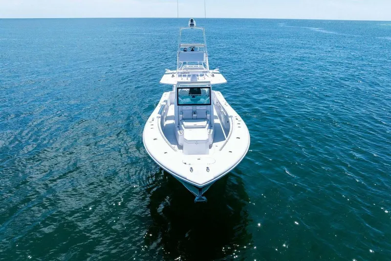 Midnight Rider Yacht Photos Pics 2017 Yellowfin 42 Offshore boat on open sea, viewed from the front.