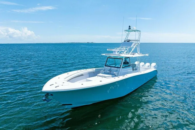 Midnight Rider Yacht Photos Pics 2017 Yellowfin 42 Offshore boat on calm blue ocean waters.