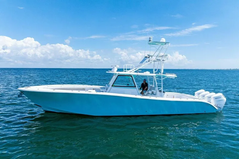 Midnight Rider Yacht Photos Pics 2017 Yellowfin 42 Offshore boat on open sea under clear blue sky.