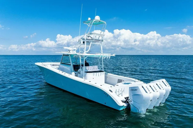 Midnight Rider Yacht Photos Pics 2017 Yellowfin 42 Offshore boat on open water, clear sky background.