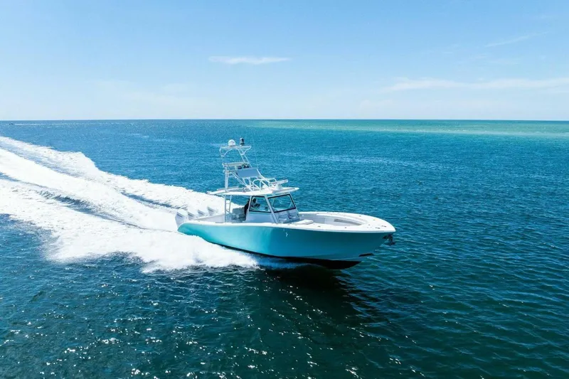 Midnight Rider Yacht Photos Pics 2017 Yellowfin 42 Offshore boat cruising on open blue ocean.