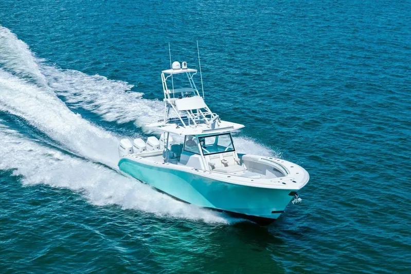 Midnight Rider Yacht Photos Pics 2017 Yellowfin 42 Offshore boat cruising on open blue water.