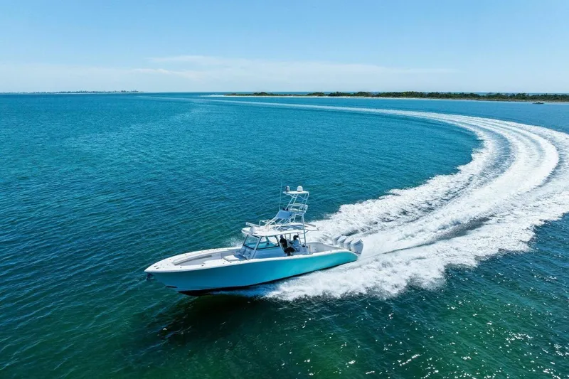 Midnight Rider Yacht Photos Pics 2017 Yellowfin 42 Offshore boat cruising on clear blue ocean waters.