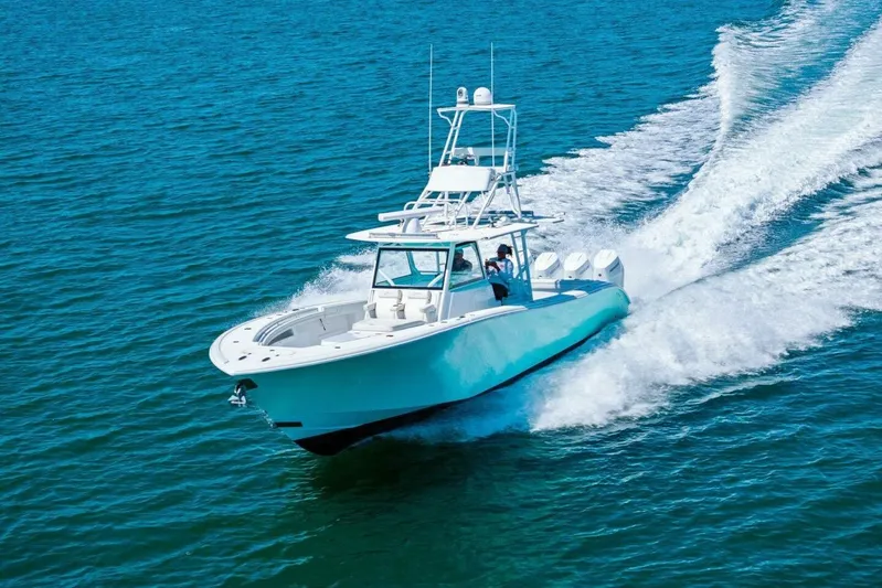 Midnight Rider Yacht Photos Pics 2017 Yellowfin 42 Offshore boat cruising on open blue water.