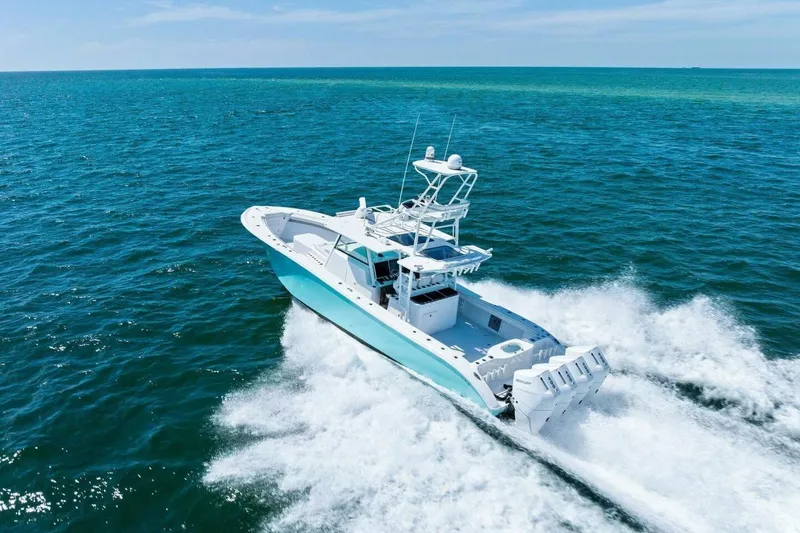 Midnight Rider Yacht Photos Pics 2017 Yellowfin 42 Offshore boat cruising on open blue ocean waters.