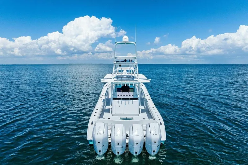 Midnight Rider Yacht Photos Pics 2017 Yellowfin 42 Offshore boat on open sea under blue sky.