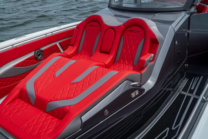  Yacht Photos Pics Luxurious red and gray seating on 2024 MTI V42 boat, featuring sleek design and premium materials.