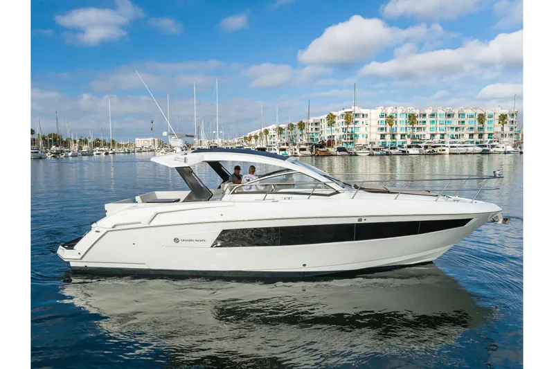 Lux Life Yacht Photos Pics 2017 Cruisers Yachts 39 Express Coupe on calm water, marina background.