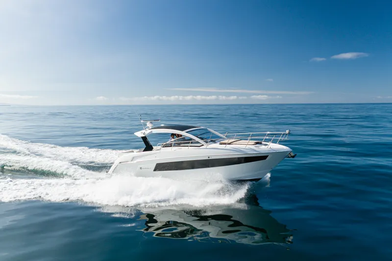 Lux Life Yacht Photos Pics 2017 Cruisers Yachts 39 Express Coupe cruising on open water under clear skies.