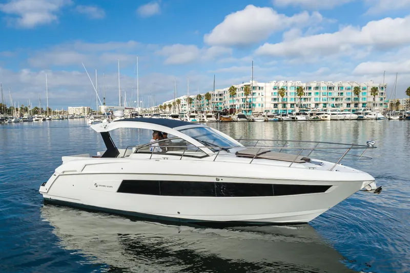 Lux Life Yacht Photos Pics 2017 Cruisers Yachts 39 Express Coupe on calm water, marina background.