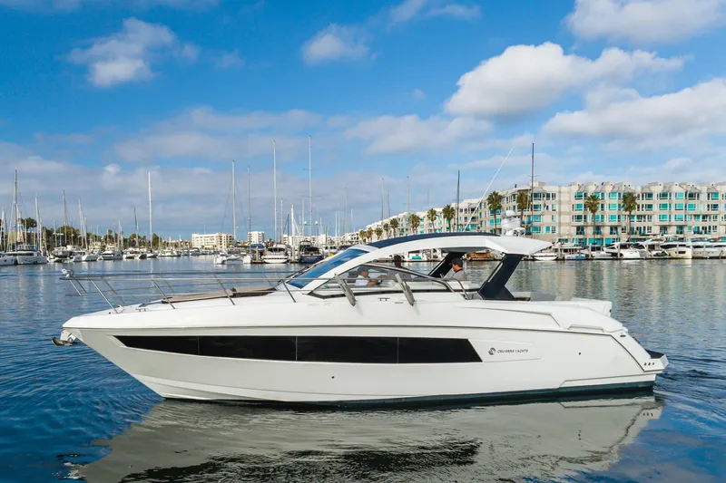 Lux Life Yacht Photos Pics 2017 Cruisers Yachts 39 Express Coupe on calm marina waters under blue sky.
