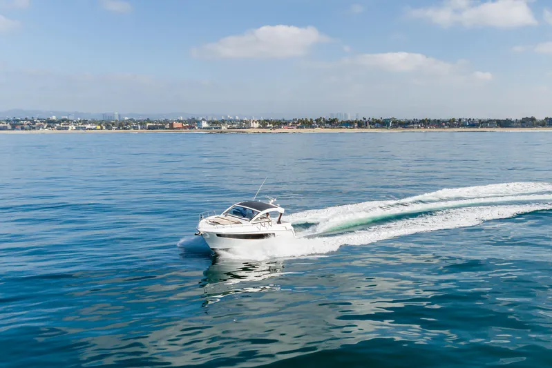 Lux Life Yacht Photos Pics 2017 Cruisers Yachts 39 Express Coupe cruising on calm ocean waters.