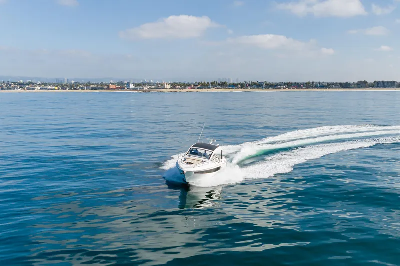Lux Life Yacht Photos Pics 2017 Cruisers Yachts 39 Express Coupe cruising on calm ocean waters.