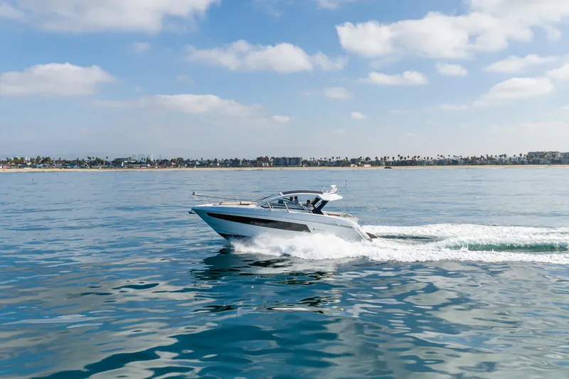 Lux Life Yacht Photos Pics 2017 Cruisers Yachts 39 Express Coupe cruising on calm ocean waters.
