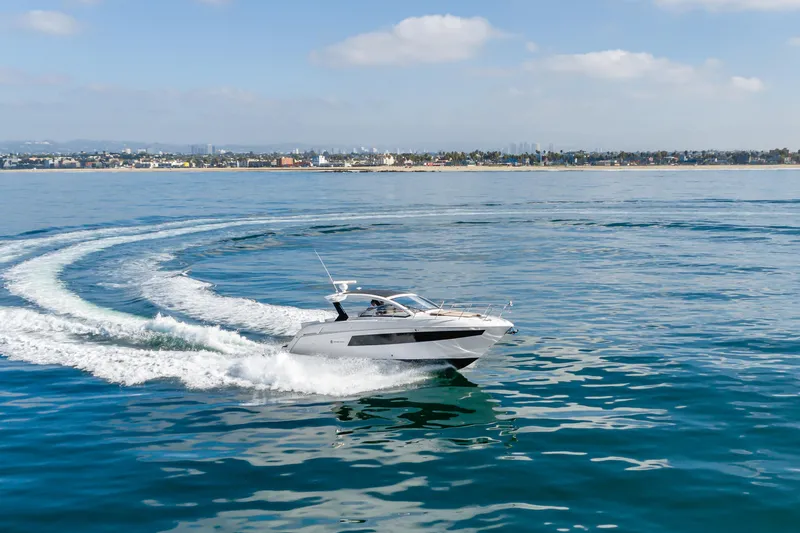 Lux Life Yacht Photos Pics 2017 Cruisers Yachts 39 Express Coupe cruising on calm ocean waters.