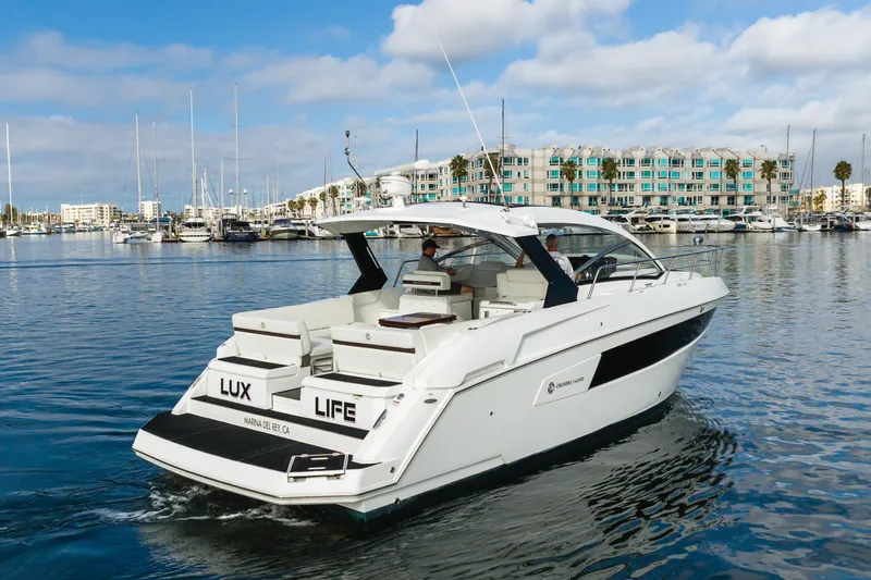 Lux Life Yacht Photos Pics 2017 Cruisers Yachts 39 Express Coupe in marina, clear sky, calm water.