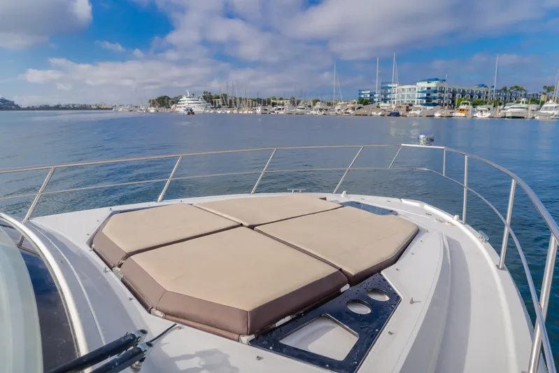 Lux Life Yacht Photos Pics 2017 Cruisers Yachts 39 Express Coupe on calm water with marina view.